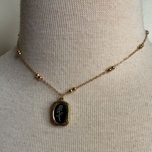 Gold tone necklace with rose motif, NWOT